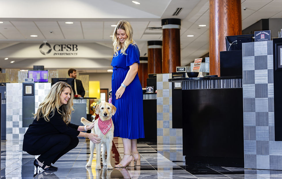 Two CFSB employees with a dog