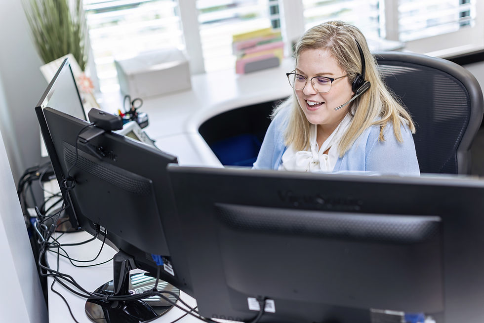 CFSB employee sitting at a computer